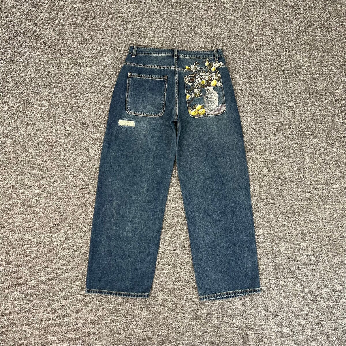Derchutze niche retro ripped jeans for men and women, high street style, vibe embroidered loose silhouette casual trousers.